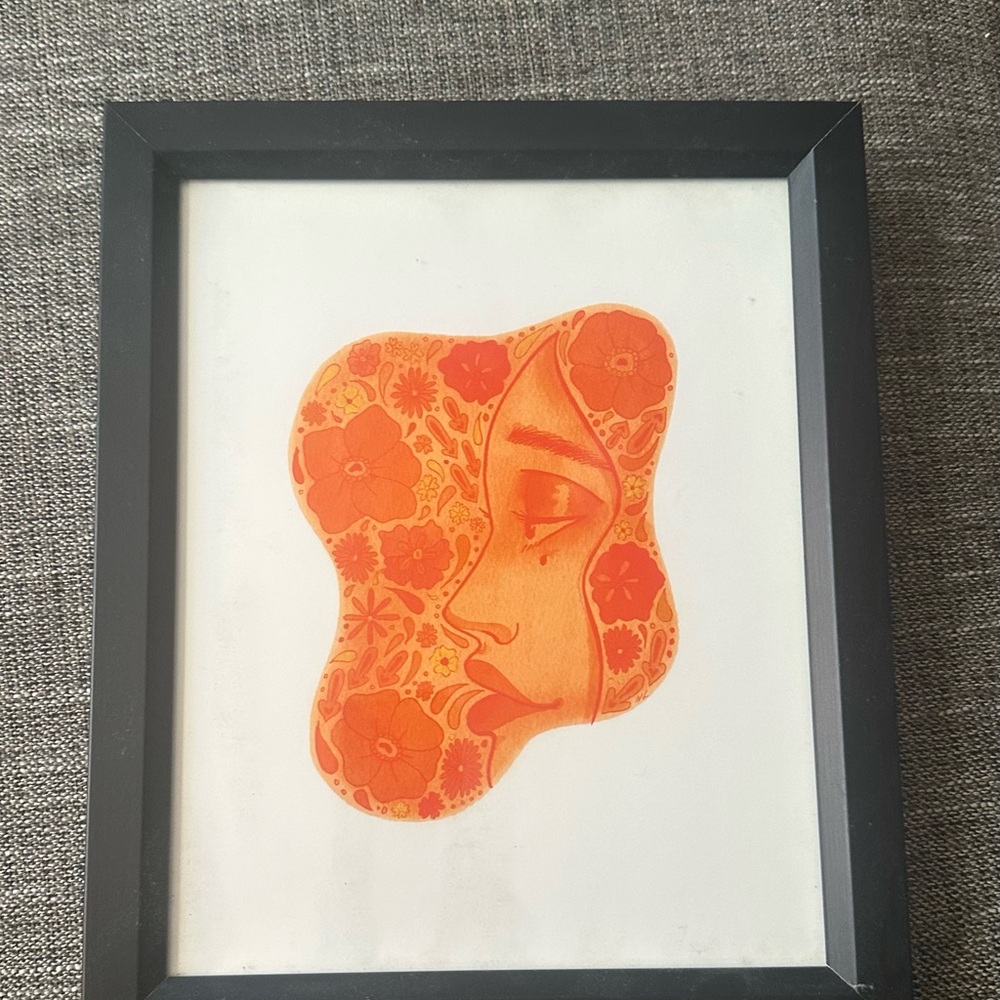 Vibrant Orange Floral Face Art in Black Frame